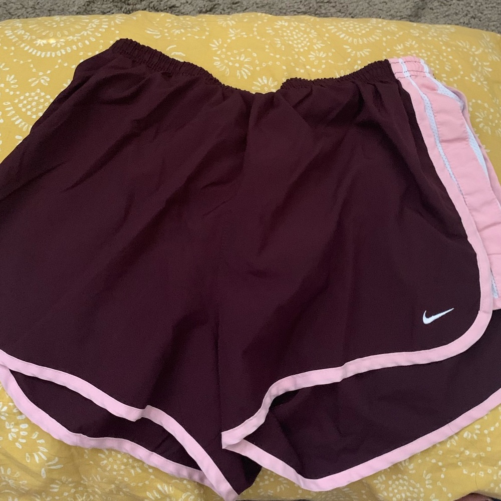 Purple and pink nike shorts
